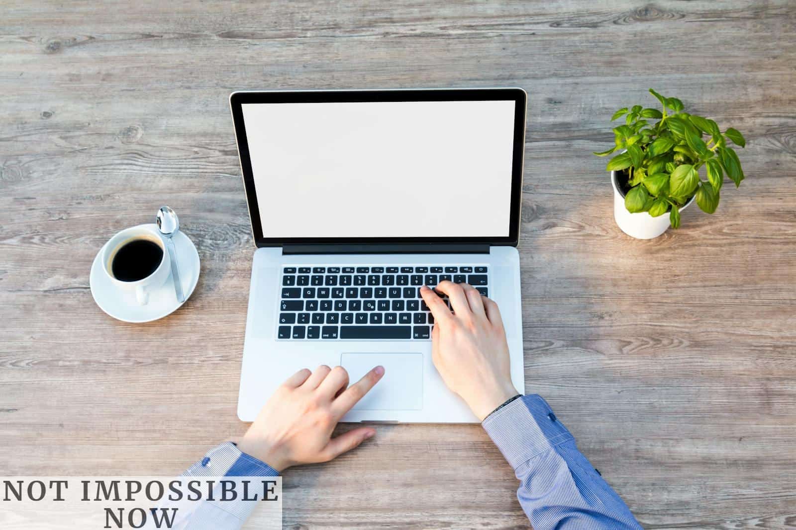 Person's Hand on Laptop