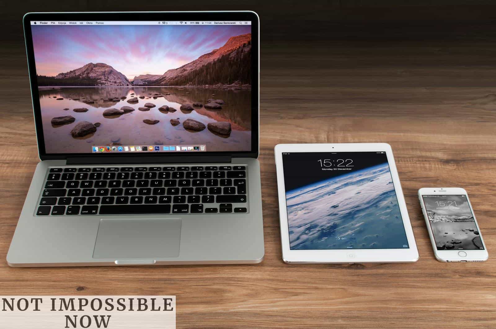 Macbook Pro Beside White Ipad