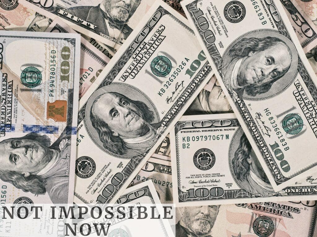 a pile of twenty dollar bills laying on top of each other